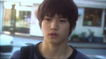 Movie still from “All About Lily Chou-Chou” (2001), directed by Shunji Iwai – A person with short hair; Close Up shot, Low angle
