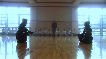 Movie still from “All About Lily Chou-Chou” (2001), directed by Shunji Iwai – A group of young people playing a game of tug - o - war; Wide shot, Low angle