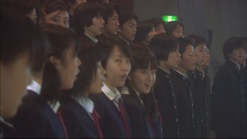 Movie still from “All About Lily Chou-Chou” (2001), directed by Shunji Iwai – A group of young people standing in a row; Close Up shot, High angle