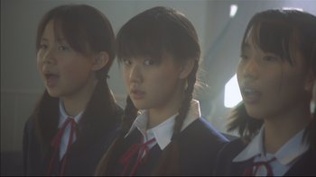 Movie still from “All About Lily Chou-Chou” (2001), directed by Shunji Iwai – A group of young asian girls standing next to each other; Close Up shot, Low angle