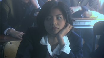 Movie still from “All About Lily Chou-Chou” (2001), directed by Shunji Iwai – A woman in a business suit sitting in a car; Close Up shot, Low angle