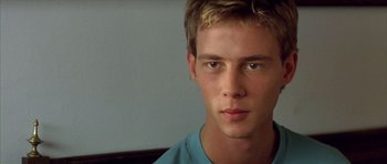 Movie still from “All About My Mother” (1999), directed by Pedro Almodóvar – A person with a blue shirt; Close Up shot, Over the shoulder angle