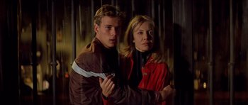 Movie still from “All About My Mother” (1999), directed by Pedro Almodóvar – A man and a woman standing next to each other; Medium shot, Low angle