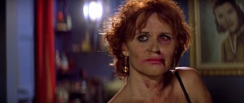 Movie still from “All About My Mother” (1999), directed by Pedro Almodóvar – A person with blood all over her face; Close Up shot, Low angle