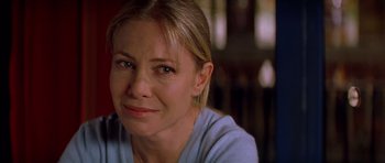 Movie still from “All About My Mother” (1999), directed by Pedro Almodóvar – A person wearing a blue shirt; Close Up shot, Over the shoulder angle