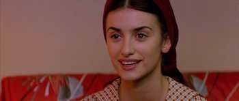 Movie still from “All About My Mother” (1999), directed by Pedro Almodóvar – A person wearing a headscarf; Close Up shot, Over the shoulder angle