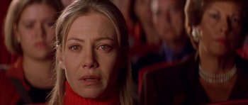 Movie still from “All About My Mother” (1999), directed by Pedro Almodóvar – A person wearing a red sweater; Close Up shot, Low angle