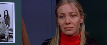 Movie still from “All About My Mother” (1999), directed by Pedro Almodóvar – A person wearing a red shirt; Close Up shot, Over the shoulder angle