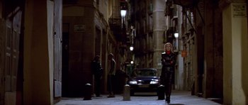 Movie still from “All About My Mother” (1999), directed by Pedro Almodóvar – A woman is walking down the street at night; Wide shot, Low angle