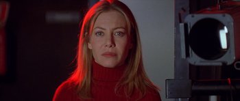 Movie still from “All About My Mother” (1999), directed by Pedro Almodóvar – A person wearing a red sweater; Close Up shot, Low angle
