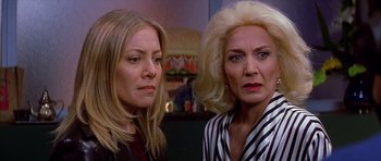 Movie still from “All About My Mother” (1999), directed by Pedro Almodóvar – Two women standing next to each other in front of a wall; Close Up shot, Low angle