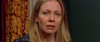 Movie still from “All About My Mother” (1999), directed by Pedro Almodóvar – A person with long blonde hair; Close Up shot, Over the shoulder angle