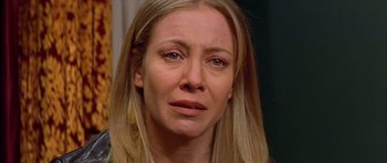 Movie still from “All About My Mother” (1999), directed by Pedro Almodóvar – A person with a sad face; Close Up shot, High angle