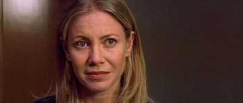 Movie still from “All About My Mother” (1999), directed by Pedro Almodóvar – A person with long hair; Close Up shot, Over the shoulder angle