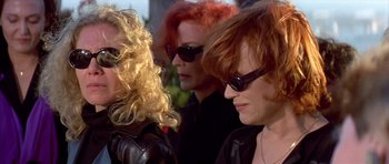 Movie still from “All About My Mother” (1999), directed by Pedro Almodóvar – A group of women wearing sunglasses standing next to each other; Close Up shot, Low angle