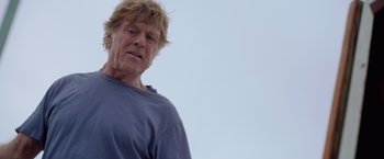 Movie still from “All Is Lost” (2013), directed by J.C. Chandor – An older man is looking at the sky; Close Up shot, Low angle
