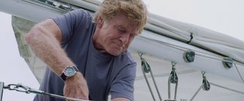 Movie still from “All Is Lost” (2013), directed by J.C. Chandor – An older man looking down at his wrist watch; Close Up shot, Low angle