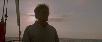 Movie still from “All Is Lost” (2013), directed by J.C. Chandor – A man standing on top of a beach near the ocean; Close Up shot, Low angle