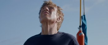 Movie still from “All Is Lost” (2013), directed by J.C. Chandor – A person looking up at the sky; Close Up shot, Low angle