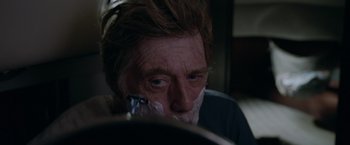 Movie still from “All Is Lost” (2013), directed by J.C. Chandor – A person with a shaving brush; Extreme Close Up shot, Over the shoulder angle