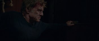 Movie still from “All Is Lost” (2013), directed by J.C. Chandor – A person holding something in his hand; Close Up shot, Low angle