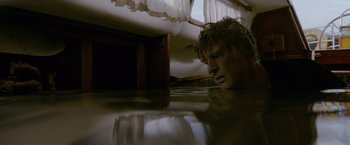 Movie still from “All Is Lost” (2013), directed by J.C. Chandor – A man is submerged in a body of water; Close Up shot, Low angle