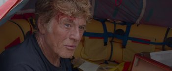 Movie still from “All Is Lost” (2013), directed by J.C. Chandor – An older man with a scar on his face; Close Up shot, Over the shoulder angle