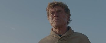 Movie still from “All Is Lost” (2013), directed by J.C. Chandor – An older man is looking into the distance; Close Up shot, Low angle