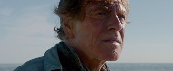 Movie still from “All Is Lost” (2013), directed by J.C. Chandor – An older man with a very large forehead; Close Up shot, Low angle