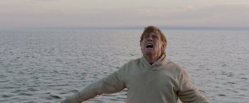 Movie still from “All Is Lost” (2013), directed by J.C. Chandor – A man standing in the water with his mouth open; Medium shot, Low angle