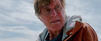 Movie still from “All Is Lost” (2013), directed by J.C. Chandor – An older man is looking into the camera; Close Up shot, Low angle