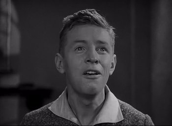 Movie still from “All Quiet on the Western Front” (1930), directed by Lewis Milestone – A young man is looking up at the sky; Close Up shot, Low angle