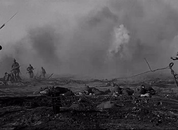 Movie still from “All Quiet on the Western Front” (1930), directed by Lewis Milestone – A black and white photo of a war scene with smoke coming out; Extreme Wide shot, Low angle