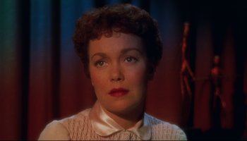 Movie still from “All That Heaven Allows” (1955), directed by Douglas Sirk – A person with short curly hair; Close Up shot, High angle