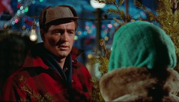 Movie still from “All That Heaven Allows” (1955), directed by Douglas Sirk – A man wearing a hat and a red jacket; Close Up shot, Over the shoulder angle