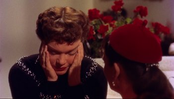 Movie still from “All That Heaven Allows” (1955), directed by Douglas Sirk – A woman looking at her reflection in a mirror; Close Up shot, High angle