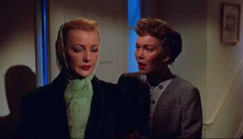 Movie still from “All That Heaven Allows” (1955), directed by Douglas Sirk – Two women are standing next to each other in a room; Close Up shot, Low angle