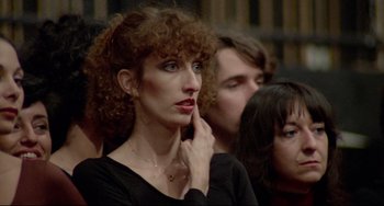 Movie still from “All That Jazz” (1979), directed by Bob Fosse – A woman with curly red hair is looking to her left; Close Up shot, High angle