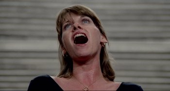 Movie still from “All That Jazz” (1979), directed by Bob Fosse – A person with mouth wide open; Close Up shot, Low angle