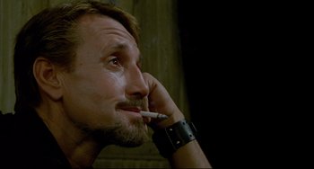 Movie still from “All That Jazz” (1979), directed by Bob Fosse – A person smoking a cigarette; Close Up shot, Low angle