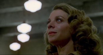 Movie still from “All That Jazz” (1979), directed by Bob Fosse – A person looking up at a ceiling; Close Up shot, Low angle