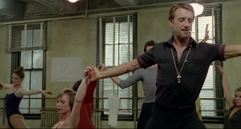 Movie still from “All That Jazz” (1979), directed by Bob Fosse – A group of people dancing in a room; Medium shot, Low angle