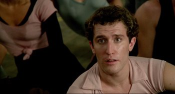 Movie still from “All That Jazz” (1979), directed by Bob Fosse – A person wearing a pink shirt; Close Up shot, Over the shoulder angle