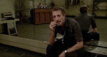 Movie still from “All That Jazz” (1979), directed by Bob Fosse – A man sitting on a chair in front of a mirror; Close Up shot, Over the shoulder angle