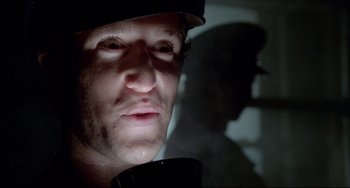 Movie still from “All That Jazz” (1979), directed by Bob Fosse – A person wearing a hat; Close Up shot, Low angle