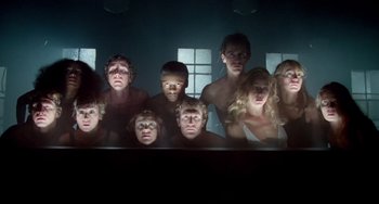 Movie still from “All That Jazz” (1979), directed by Bob Fosse – A group of people that are standing in a room together; Wide shot, Low angle