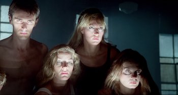 Movie still from “All That Jazz” (1979), directed by Bob Fosse – A group of three women standing next to each other in a dark room; Close Up shot, Low angle