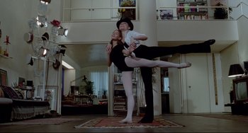 Movie still from “All That Jazz” (1979), directed by Bob Fosse – A man and a woman are performing a dance; Wide shot, Low angle