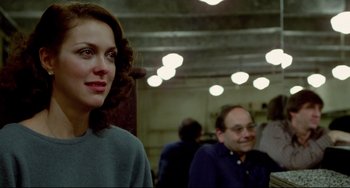 Movie still from “All That Jazz” (1979), directed by Bob Fosse – A woman standing next to a man in a room; Close Up shot, Over the shoulder angle