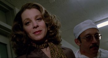 Movie still from “All That Jazz” (1979), directed by Bob Fosse – A person wearing a scarf; Close Up shot, Low angle